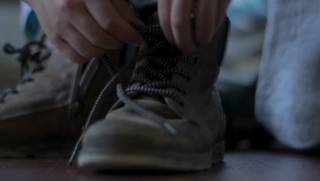 Laces-of-workers-boot-being-pulled-tight
