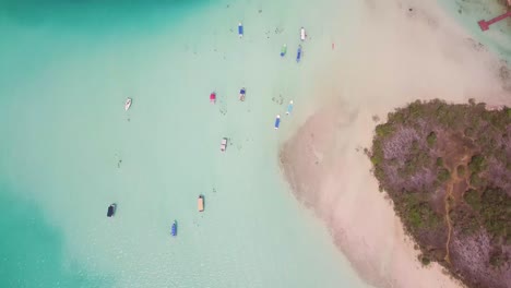 Aerial-Top-View-of-Boats-in-Lagoon-of-Seven-Colours-in-Bacalar,-Mexico