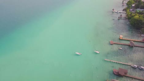 Boat-Docks-in-Lagoon-of-Seven-Colors,-Bacalar-Mexico,-Aerial-Drone-View