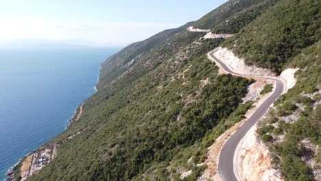 Scenic-Tortuous-Coastal-Road-at-Lefkada-Island,-Greece---Aerial