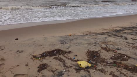 Drift-trash-on-a-polluted-sandy-beach