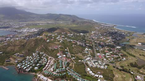 Aerial-view-overlooking-island-of-St-Kitts-in-Saint-Kitts-and-Nevis---high-angle,-panoramic,-drone-shot