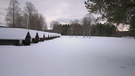 A-long-row-of-Small-Camping-Cabins-in-Snowy-Lanscape