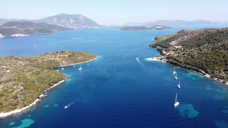 Boats-Sailing-at-Ionian-Islands-near-Nidri-and-Meganisi,-Lefkada,-Greece---Aerial