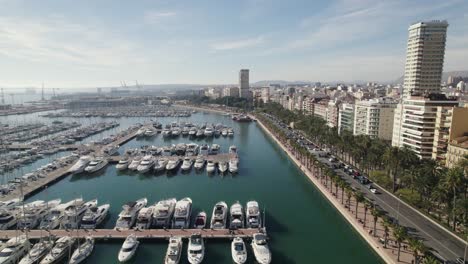 Fly-over-yacht-moored-at-marina-in-Alicante,-Spain