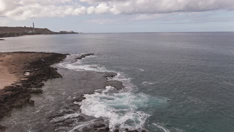 Aerial-view-of-scenic-rocky-coastline-in-Hawaii-drone-forward