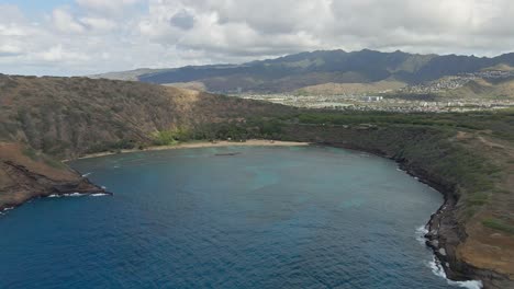 Aerial-view-of-Hanauma-bay-in-calm-water-on-sunny-day-tracking-forward