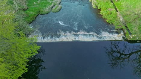 Aerial-Flyover-With-Down-Tilt-Over-A-Small-Dam