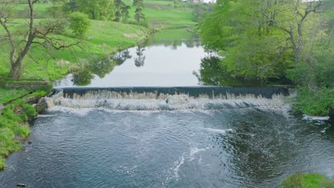 Slowmotion-Aerial-Shot-of-A-Small-Dam