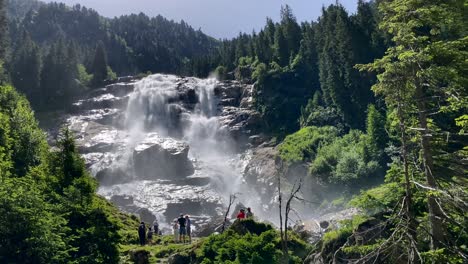 The-giant-Grawa-falls-in-Stubai-Valley-in-Austria-with-sunny-weather-and-with-some-people