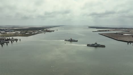 Aerial-view-of-ferrys-with-cars-crossing-Aransas-Pass-in-Texas