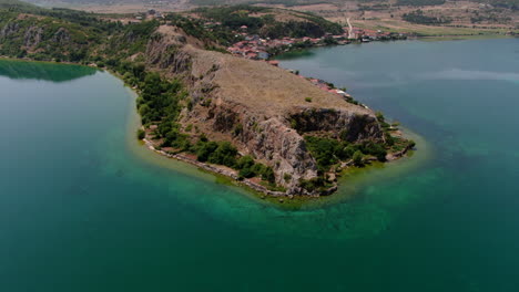 Aerial-Shot-orbit-in-Podgradec-lake,-peninsula-Podgradec-in-Albania