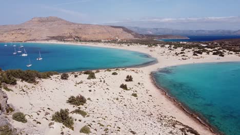 White-Sandy-Tropical-Paradise-Beach-at-Elafonisos,-Peloponnese,-Greece---Aerial