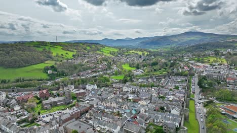 Large-residential-areas-with-traditional-gray-roofs-in-the-town-of-Conwy-amongst-the-hilly-countryside-of-Wales-on-a-cloudy-day