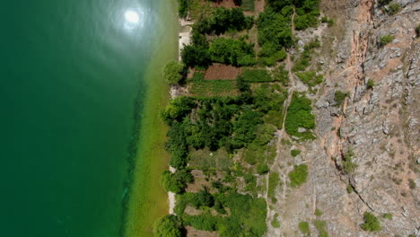Beautifu-cenital-l-Aerial-Shot-in-Podgradec-Lake-Ohrid,-peninsula-Lin,-Podgradec-in-Albania