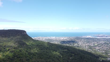 Panoramic-view-from-top-of-the-mountain-over-seaside-and-city