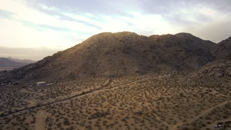 Drone-flight-footage-of-Bell-Mountain-near-the-hot-and-arid-high-desert-town-of-Apple-Valley-in-California-during-a-summer