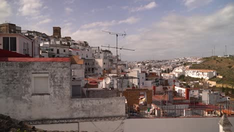 Slow-motion-pan-across-whitewashed-houses-in-Mediterranean-town-with-rooftops