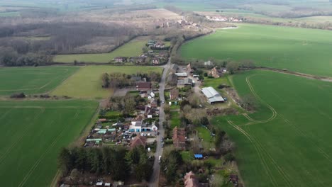 Idyllic-aerial-view-above-Nonington-small-town-farming-countryside-settlement-and-fields