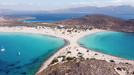 Blue-Bays-and-White-Sand-Strip-Beach-at-Elafonisos,-Peloponnese,-Greece---Aerial