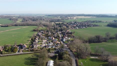 Peaceful-aerial-view-above-Nonington-rural-small-town-farming-countryside-settlement-slow-flyover