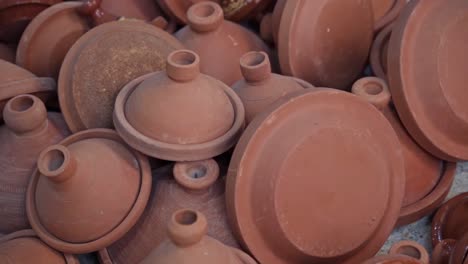 Pile-of-traditional-Moroccan-tagine-pot-for-cooking-food,-close-up-view