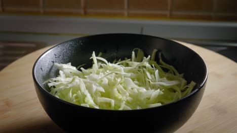 Pouring-Boiling-Water-on-Sliced-Cabbage,-Cooking-Scrambled-Eggs