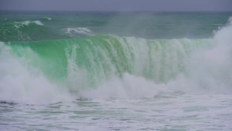 Wave-breaking-head-on-Super-slow-motion-blue-green-water-white-foam-temporary-sea-storm-on-the-Costa-Brava