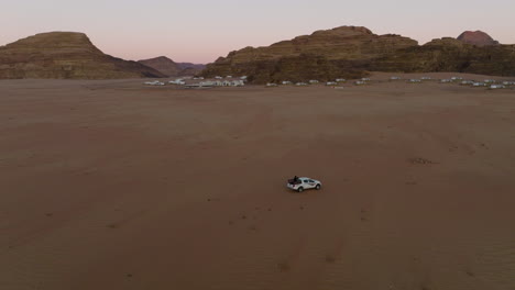 Pick-up-Vehicle-Traveling-Through-Desolate-Desert-Of-Wadi-Rum-In-Jordan