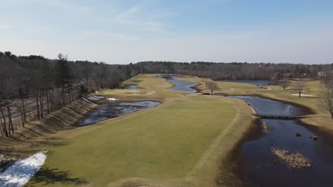 Drone-push-forward-over-a-golf-course-at-the-end-of-winter