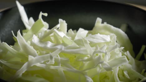 Close-up-view-of-white-cabbage-which-are-seasoned-with-salt-and-pepper