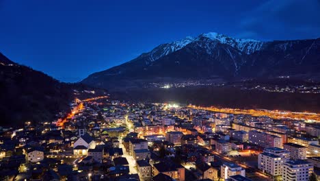 Night-timelapse-over-Brig,-a-town-in-the-Swiss-alps,-Switzerland