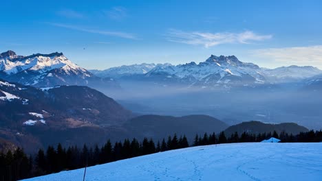 Panning-timelapse-view-of-the-snow-capped-mountains-of-the-alps-from-Leysin-in-Switzerland