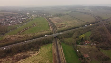 4K-Drone-footage-flying-toward-the-A2-Dual-Carriage-way-in-Canterbury-as-it-crosses-over-Hambrook-Marshes-and-a-railway-track