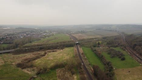 Drone-flying-towards-the-A2-dual-carriageway-in-Canterbury-also-shows-the-Hambrook-Marshes-and-Ashford-to-Canterbury-trainline