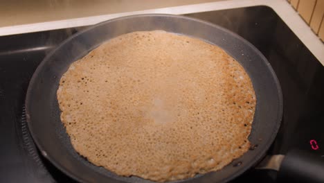 Buckwheat-Pancake-Cooking-On-A-Hot-Cast-Iron-Frying-Pan