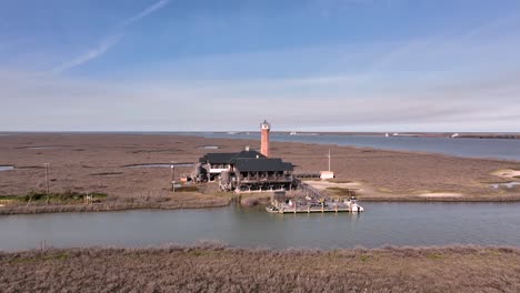 Aerial-point-of-view-of-the-Lydia-Ann-Lighthouse-in-Aransas-Pass,-Texas