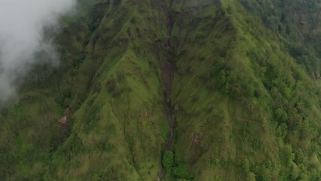Green-mountain-slope-in-tropical-Bali,-Trunyan-hill,-aerial