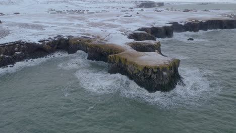 Rough-Waves-Breaking-On-Rocky-Shoreline-Of-Arnarstapi-At-Winter-In-Iceland
