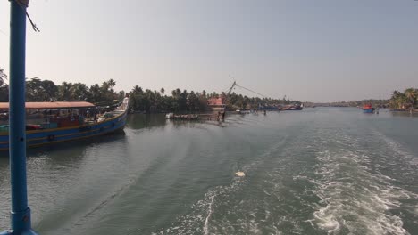 View-from-sailing-boat-of-fishing-vessel-at-Alappuzha-or-Alleppey,-India