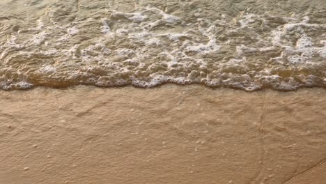 Ocean-Waves-Crash-on-the-Sandy-Beach-in-Pattaya,-Thailand