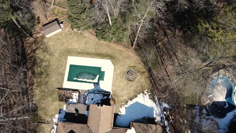 A-suburban-yard-from-the-air-in-late-winter