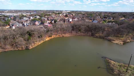Aerial-flight-of-lake-next-to-double-Tree-Ranch-Park-in-Highland-Village-Texas