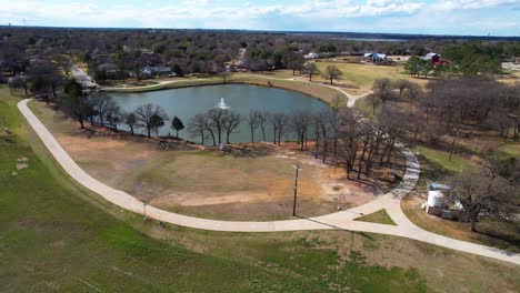 Aerial-flight-over-pong-inside-Double-Tree-Ranch-park-in-Highland-Village-Texas