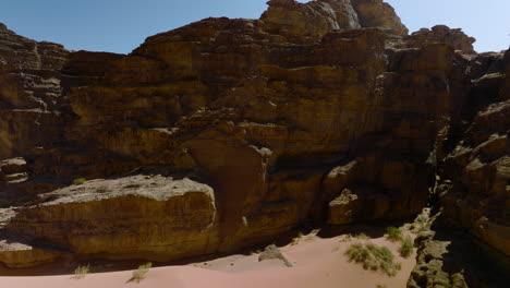 Peak-Through-Rocky-Canyons-In-Wadi-Rum-Desert-In-Jordan---aerial-shot