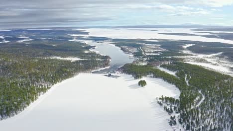 Aerial-View-Of-Frozen-River-And-Evergreen-Forests-In-Northern-Europe