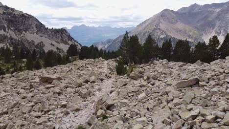 Ibon-de-Brazato-Hiking-Trail-in-Banos-de-Panticosa,-Huesca,-Aragon,-Spanish-Pyrenees-Spain---Aerial-Drone-View-of-the-Rocky-Mountain-Track
