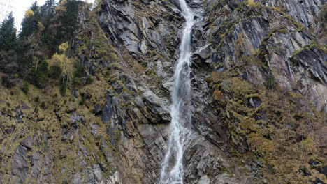 Large-waterfall-pouring-down-a-mountainside-near-Kaprun,-Austria,-in-the-stunning-Alps