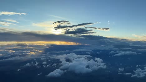 Beautiful-sunset--cloudy-sky-from-a-cockpit