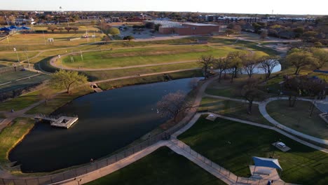 Aerial-footage-of-ponds-and-soccer-field-at-Unity-Park-in-Highland-Village-Texas